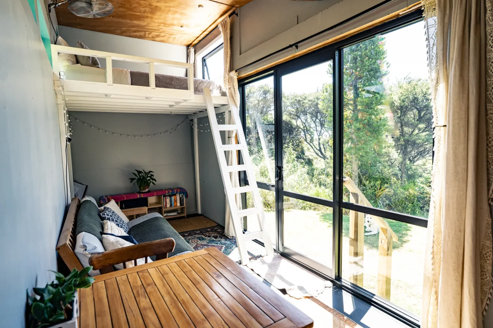 Kitchen and loft ladder in Kauri cabin at Totara Enclave