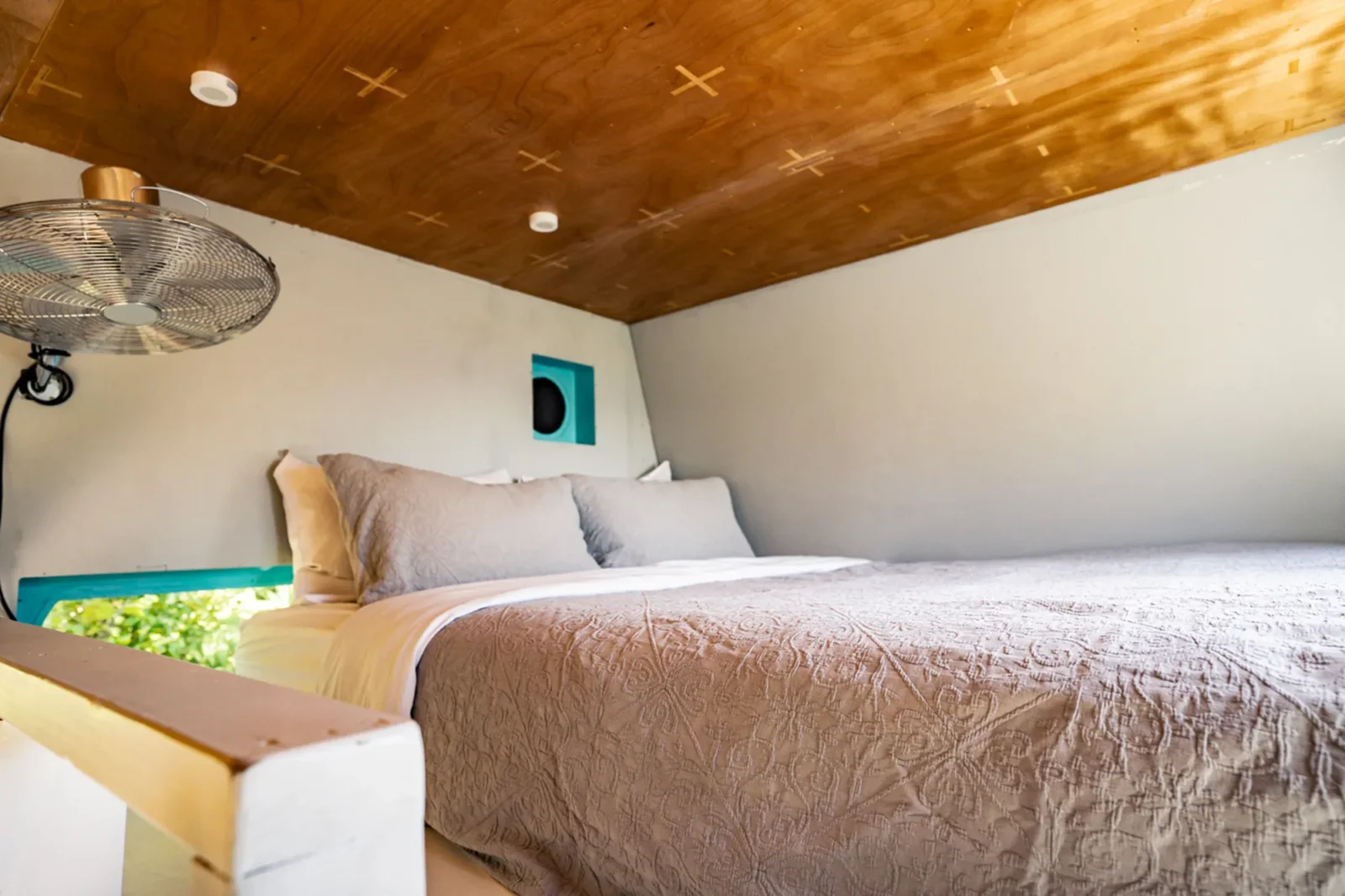 Bedroom with curved ceiling in Kauri cabin at Totara Enclave