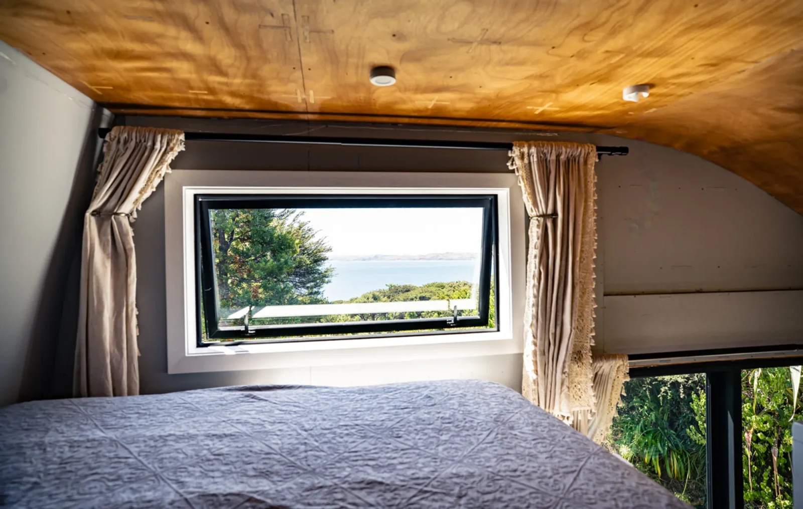 Picture window with bush views in Kauri cabin at Totara Enclave