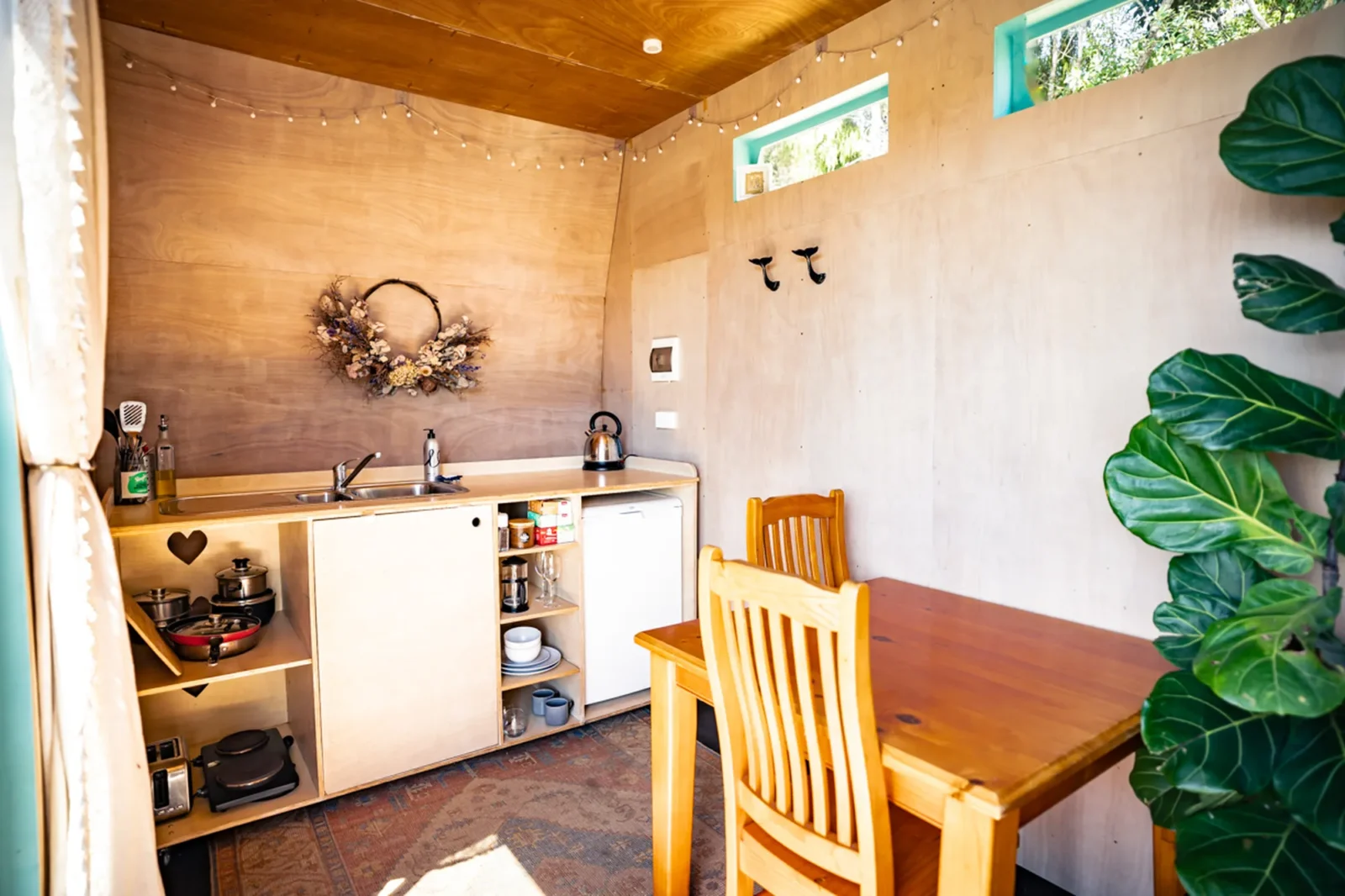 Kitchen and dining area in Kowhai cabin at Totara Enclave